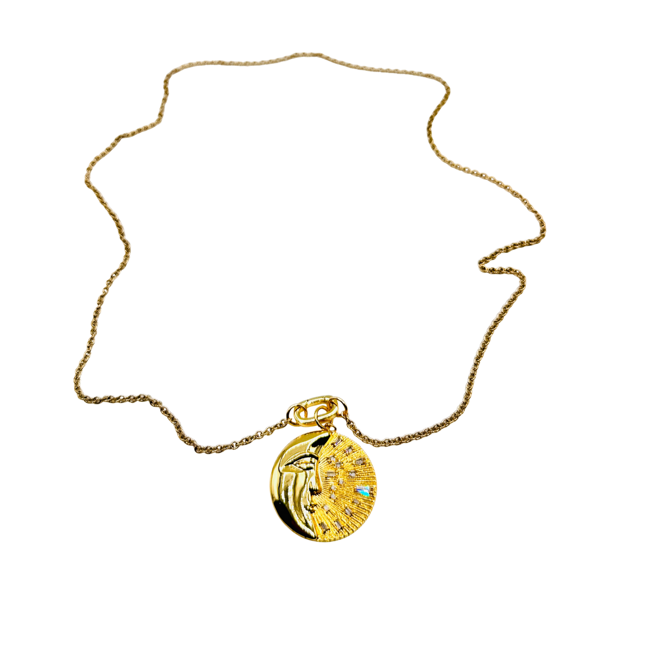 Gold necklace with a round pendant on a white background