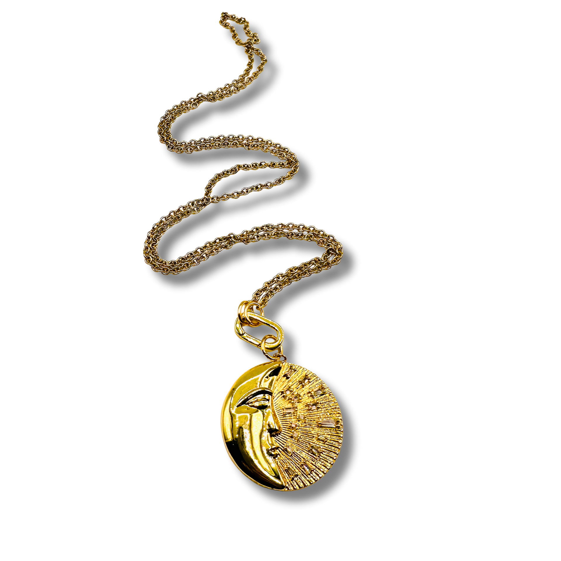 Gold necklace with a round pendant on a white background
