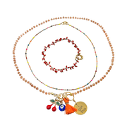 Set of beaded necklaces with colorful charms on a white background
