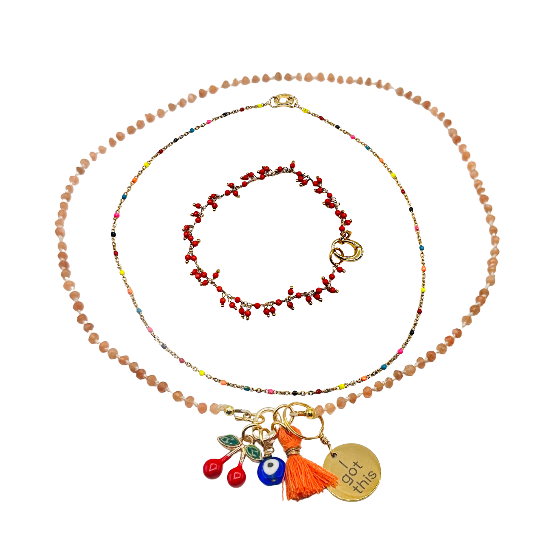 Set of beaded necklaces with colorful charms on a white background
