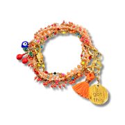 Colorful beaded bracelet with charms on a white background