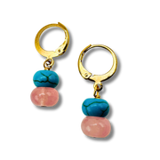 Gold hoop earrings with turquoise and pink beads on a white background