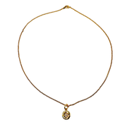 Gold necklace with a pendant on a white background
