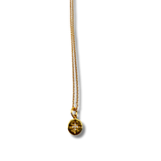 Gold necklace with a star-shaped pendant on a white background