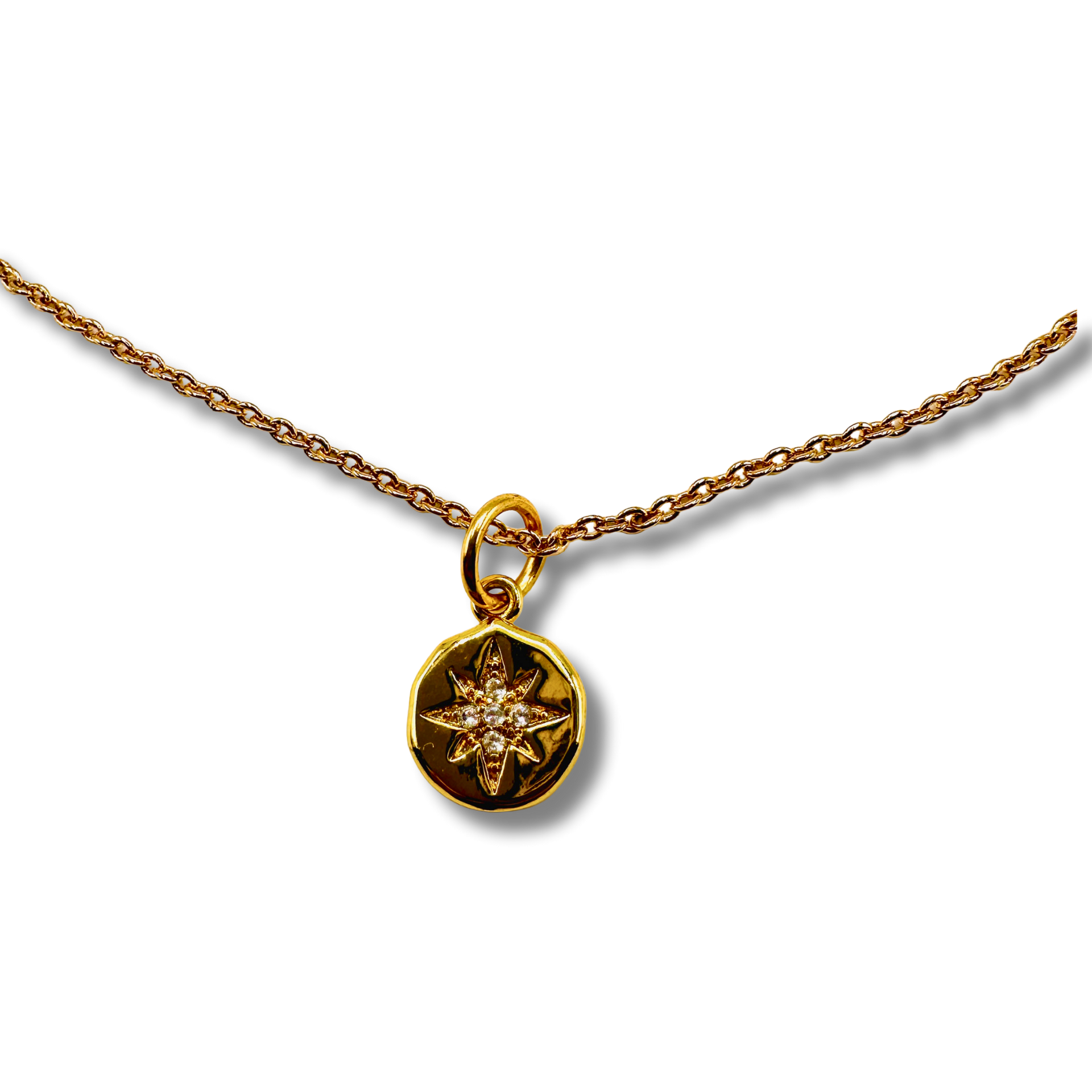 Gold necklace with a star-shaped pendant on a white background