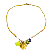 Necklace with colorful beads and charms on a white background