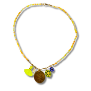 Necklace with colorful beads and charms on a white background