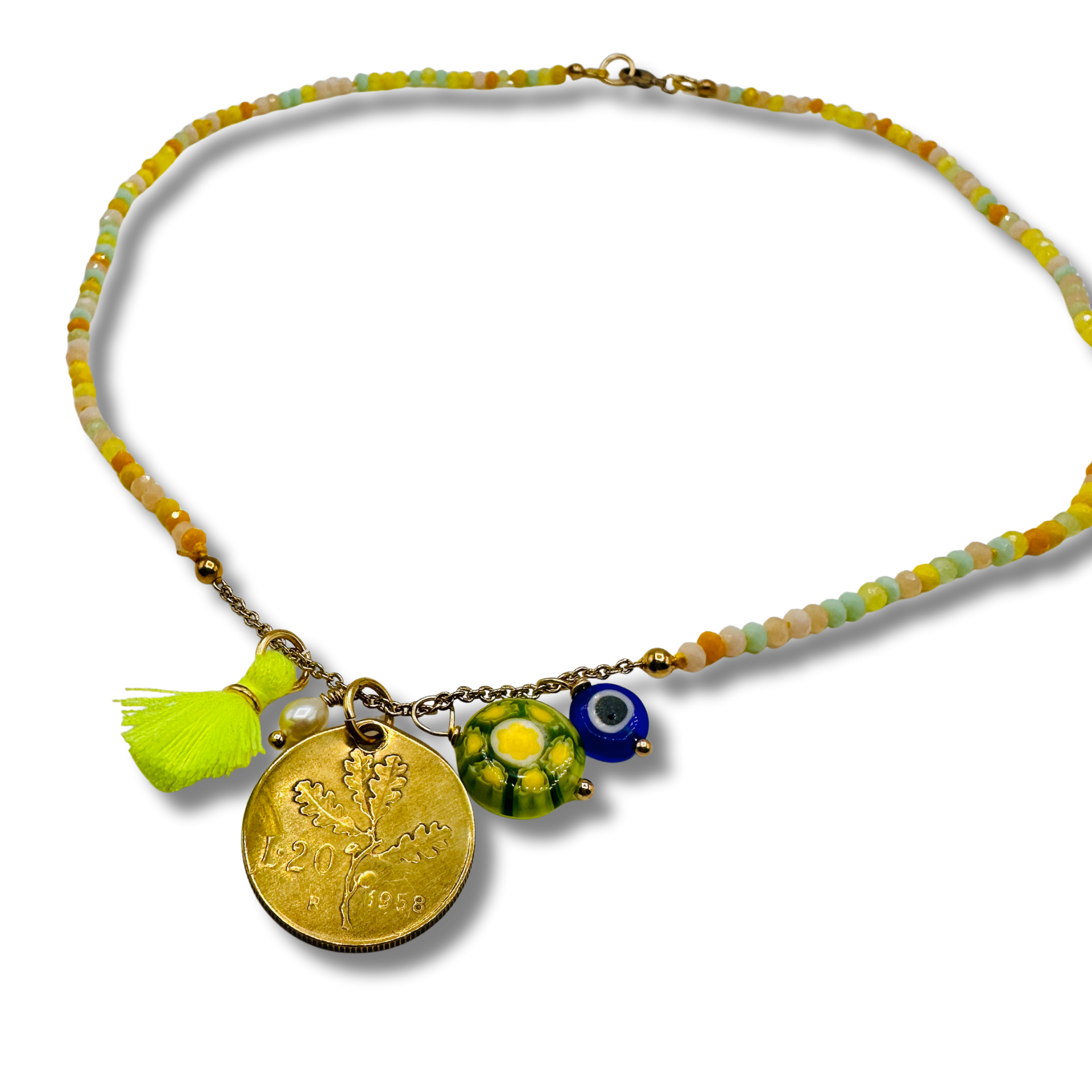 Necklace with colorful beads and charms on a white background