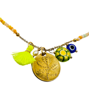 Necklace with gold coin, tassel, and colorful beads on a white background