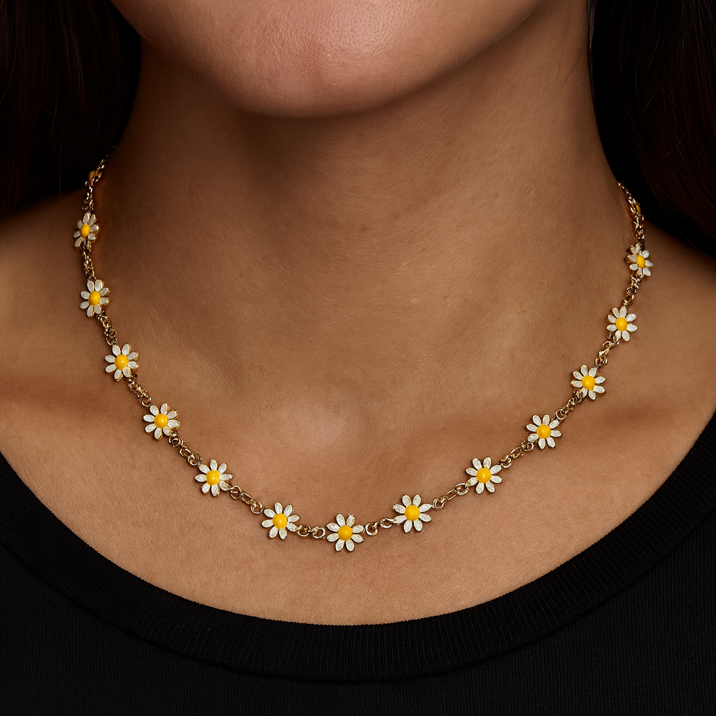 Necklace with daisy flower pendants on a person wearing a black top.