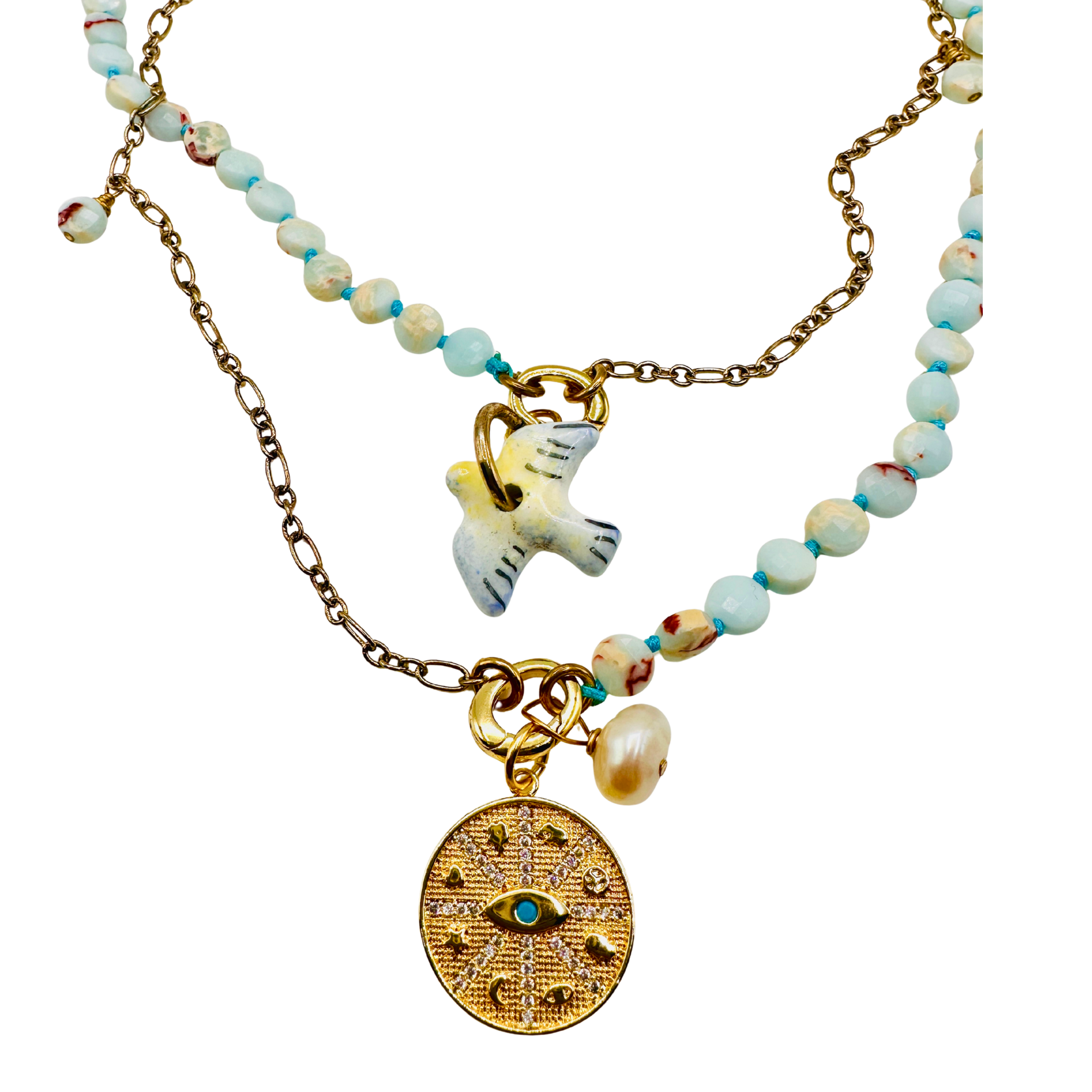 Necklace with various charms on a white background