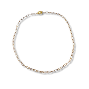 Gold chain necklace on a white background