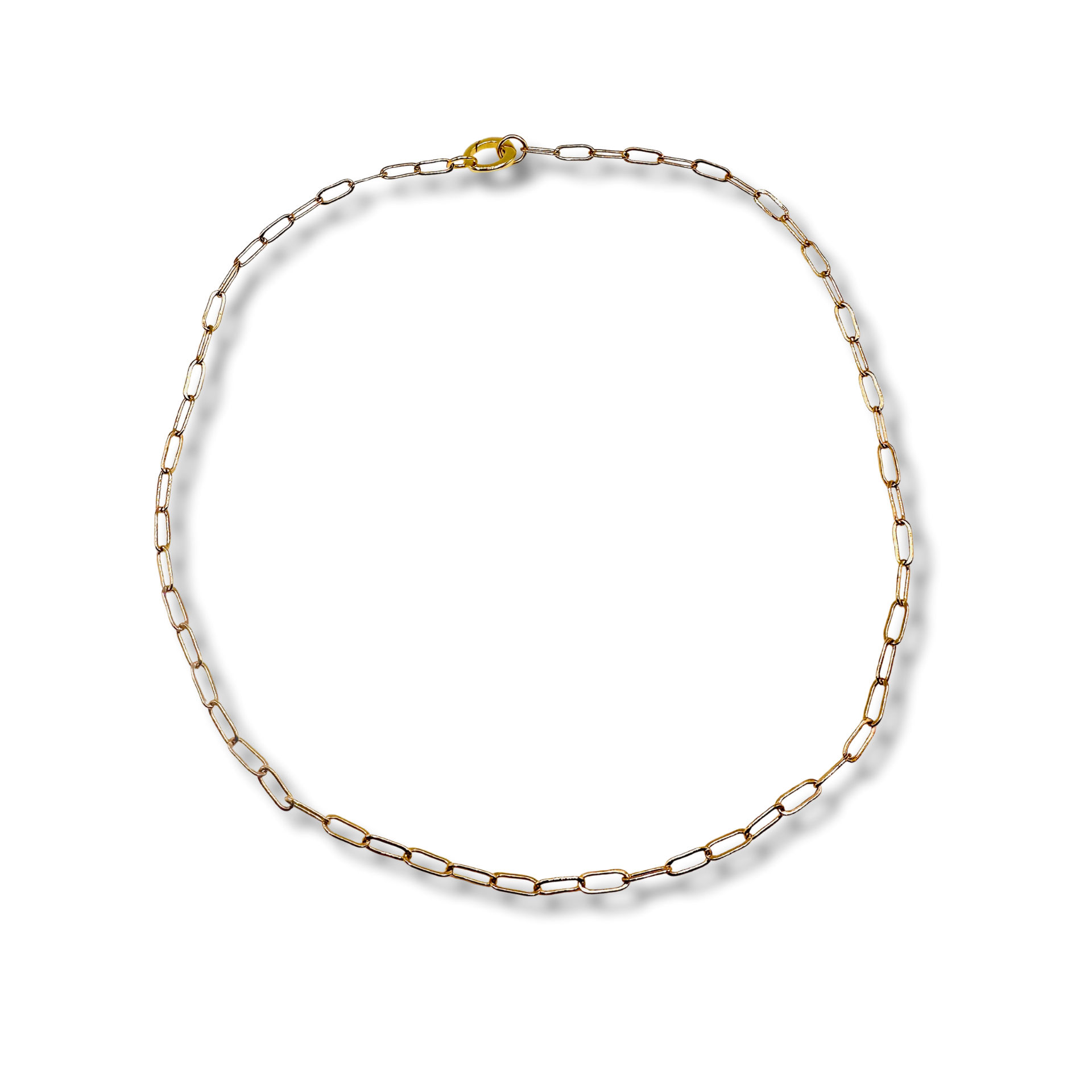 Gold chain necklace on a white background