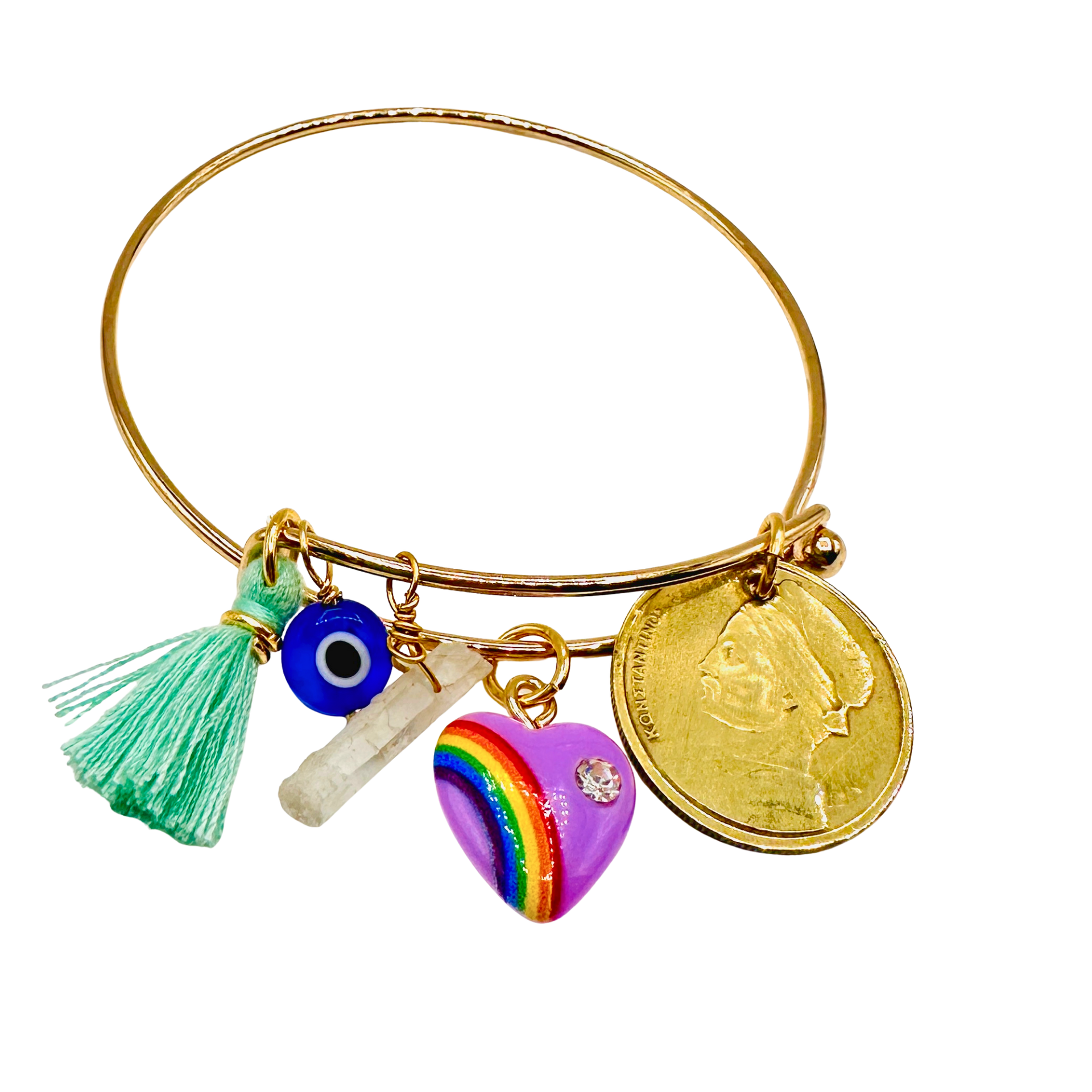 Gold bangle with various charms including a rainbow heart, tassel, and coin on a white background