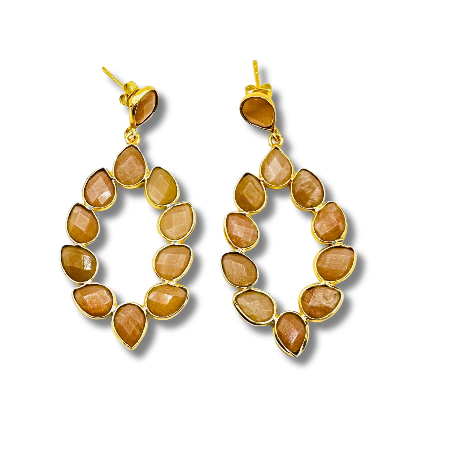 A pair of gold-plated brass bezel set cascading earrings with peach moonstone inlays.
