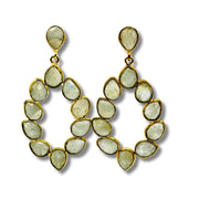 A pair of gold-plated brass bezel set stone earrings with a geometric pattern.