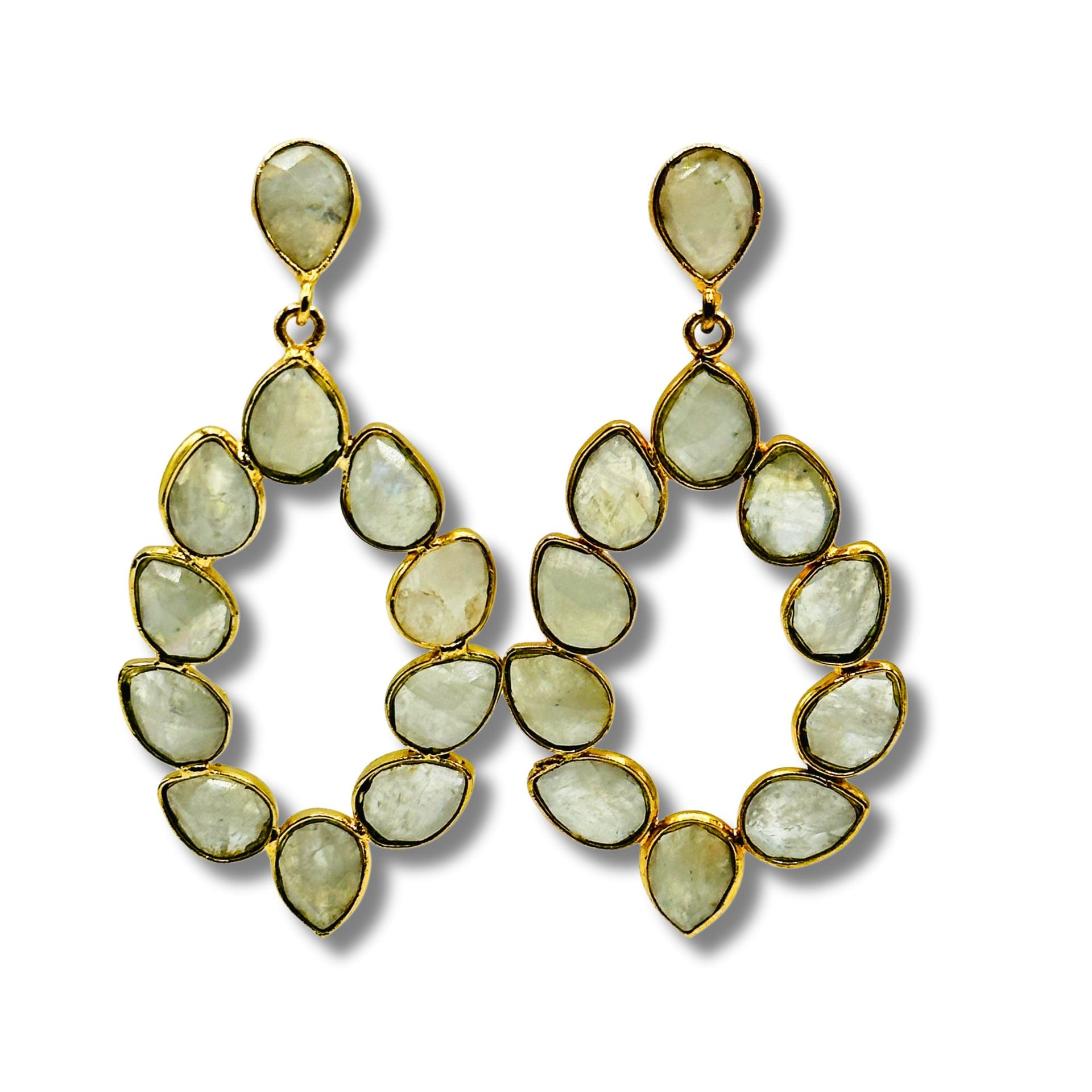 A pair of gold-plated brass bezel set stone earrings with a geometric pattern.