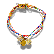 Colorful beaded bracelet with gold charms on a white background