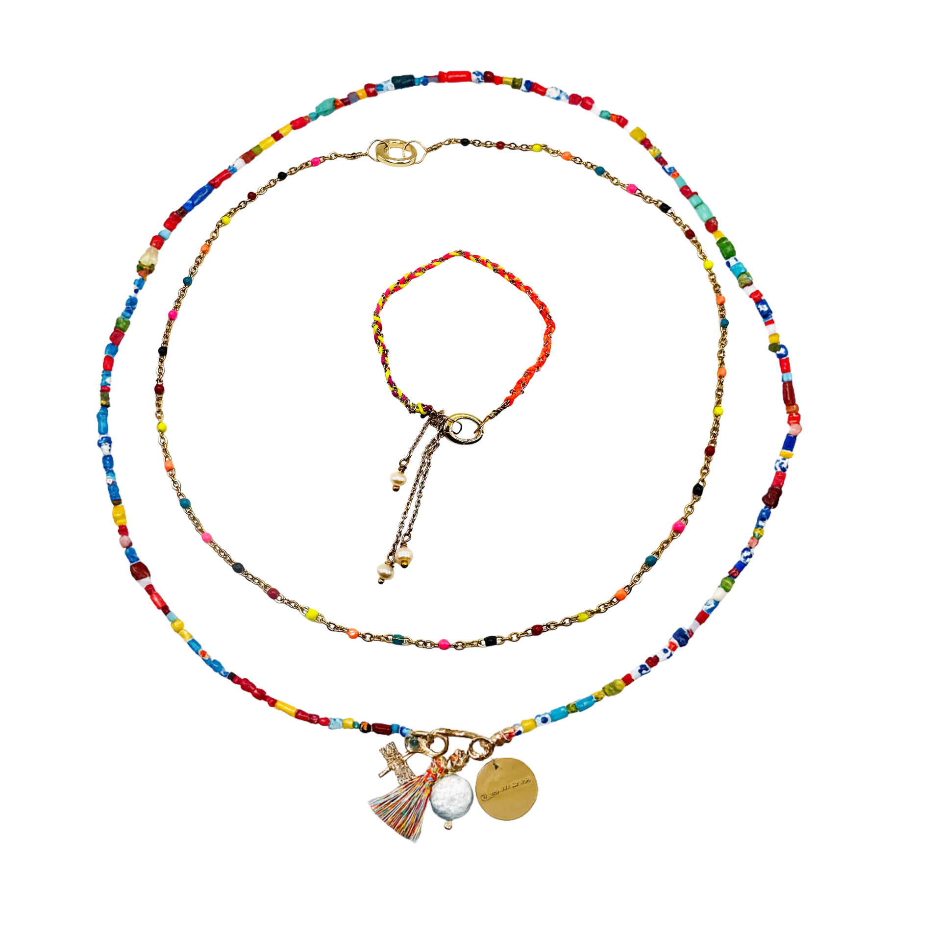 Colorful beaded necklace with charms on a white background