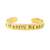 gold home is where the heart is inspirational cuff