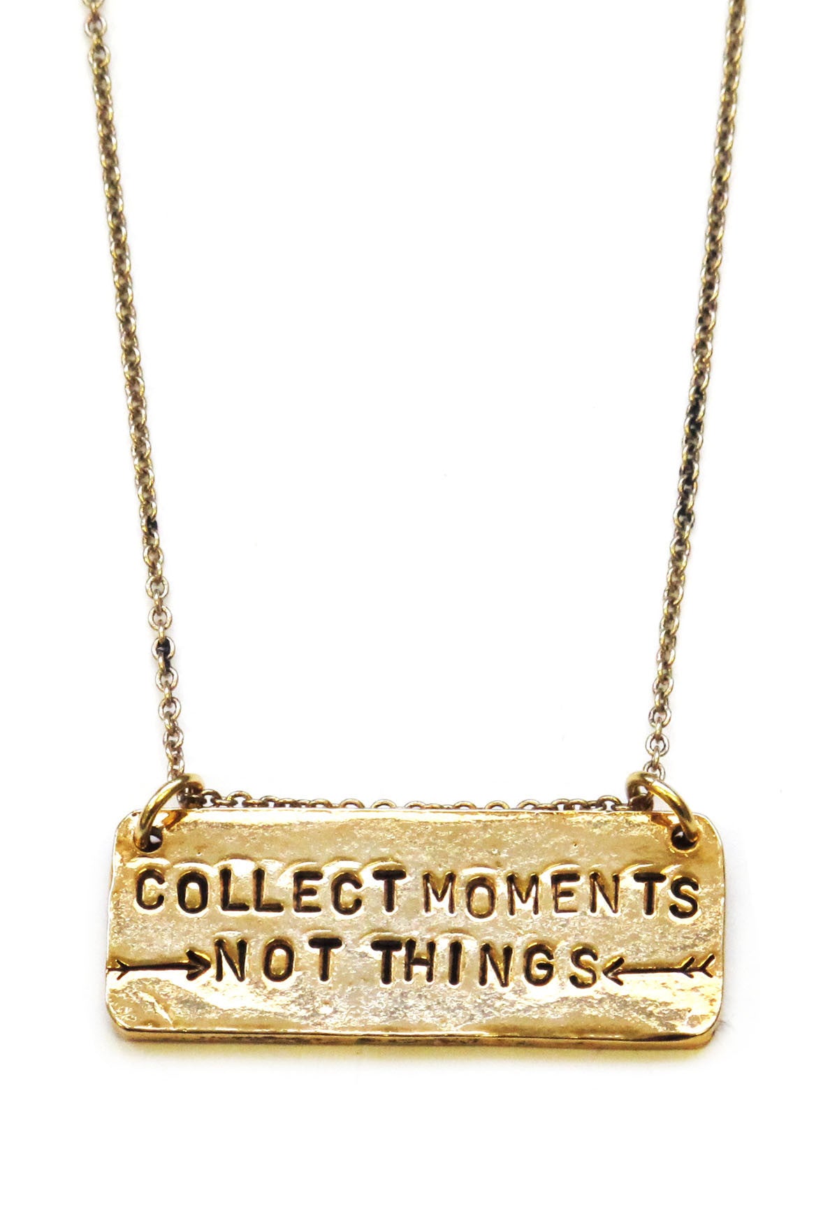 A necklace with a rectangular pendant stamped with the phrase 'Collect Moments Not Things'.