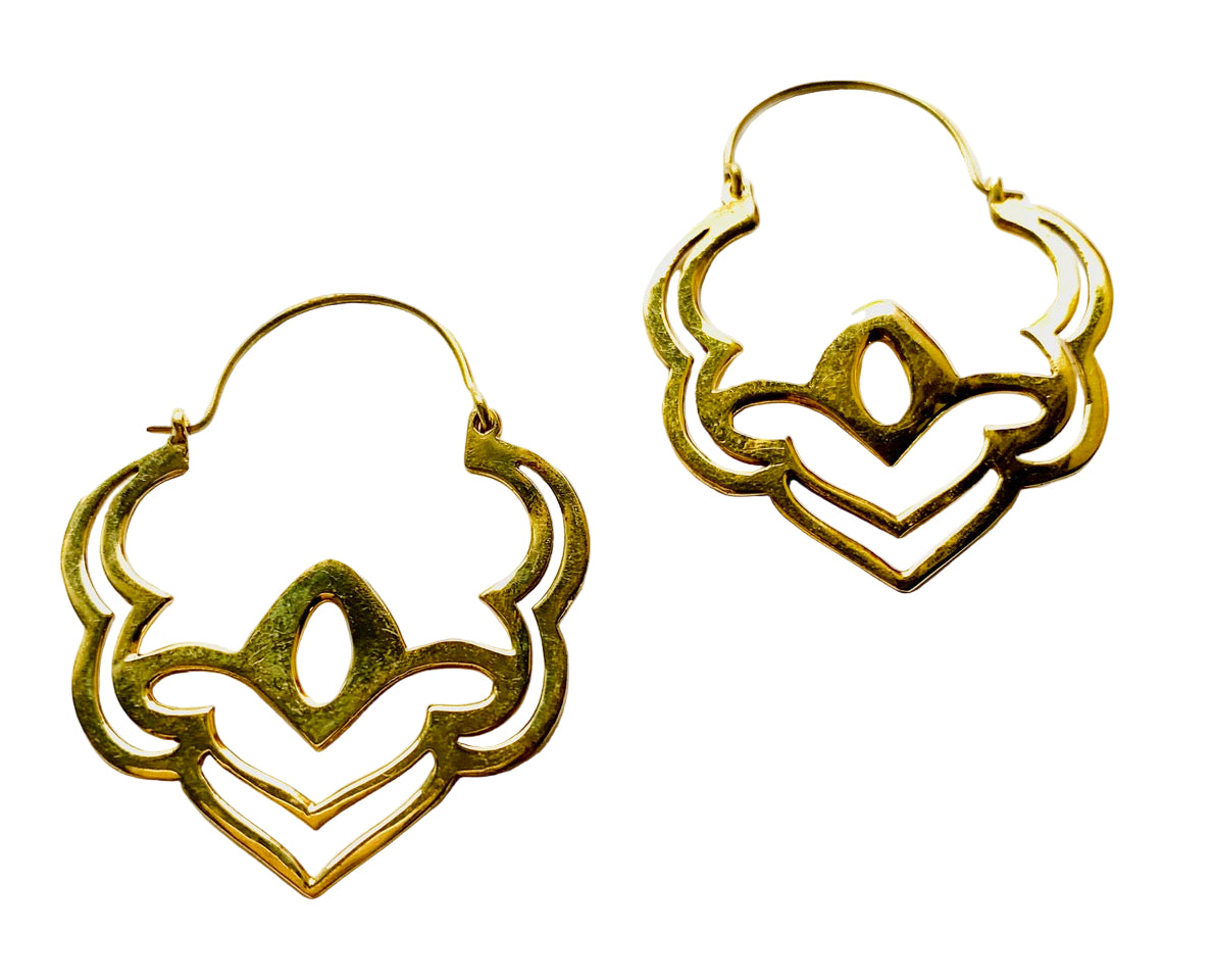 Gold hoop earrings with intricate heart designs on a white background